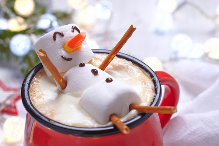 Snowman swimming in hot cocoa