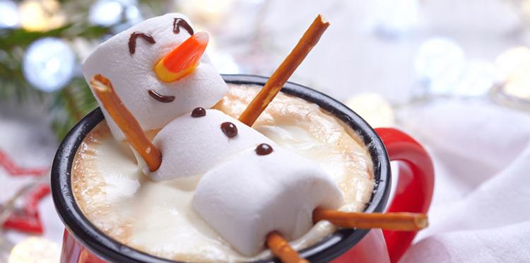 Snowman swimming in hot cocoa